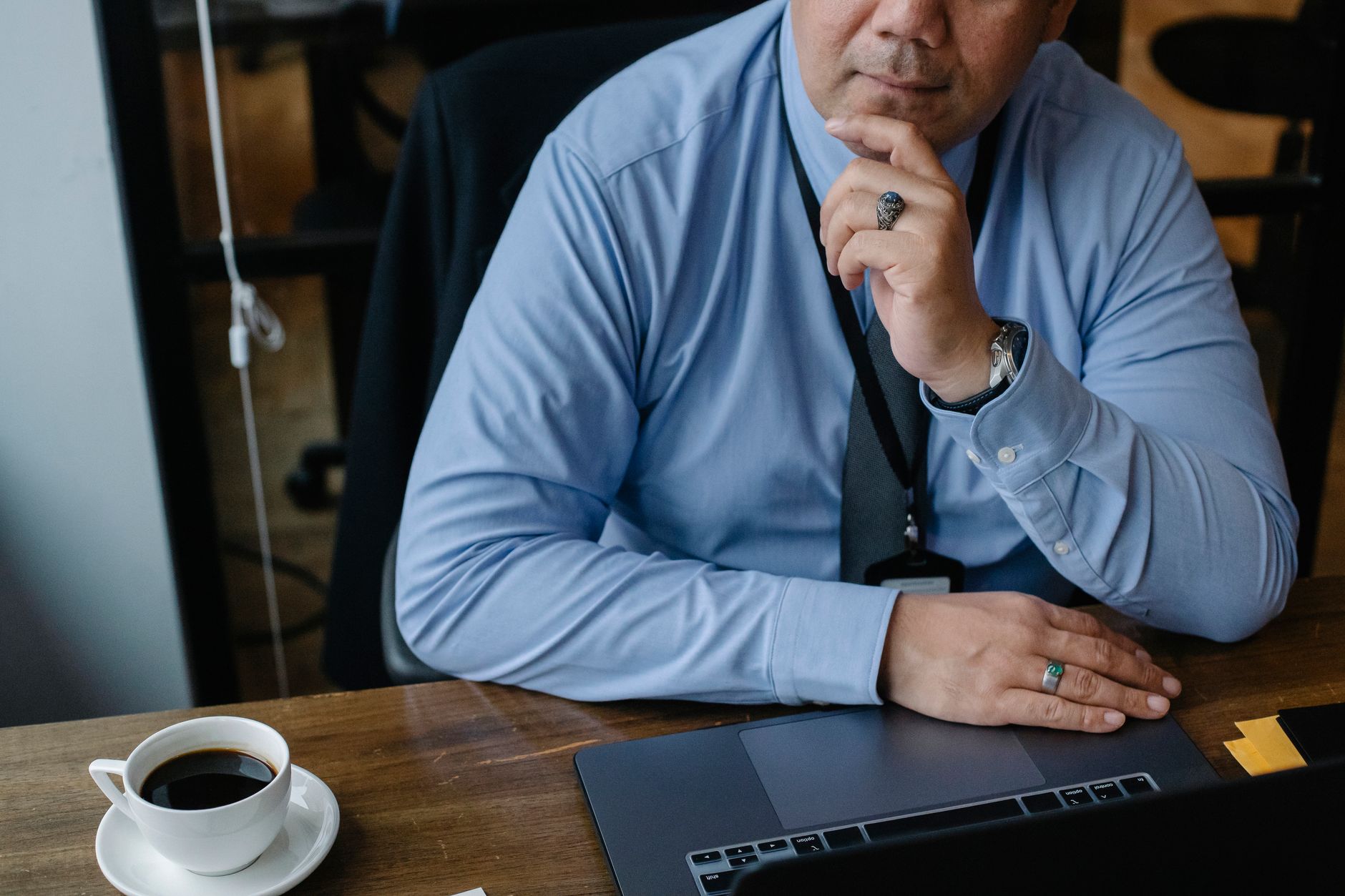 NZ business owner pausing at his laptop, weighing up whether customer data can go into an AI tool under the Privacy Act